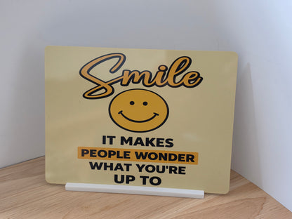 Funny Smile Sign – Smile It Makes People Wonder What You're Up To | Positive Quote Sign