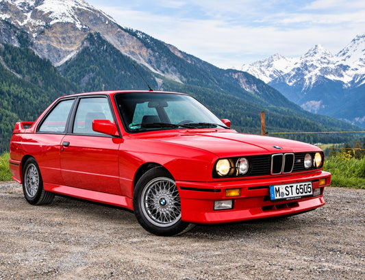 Source photo before showroom editing: red BMW parked in a mountain setting
