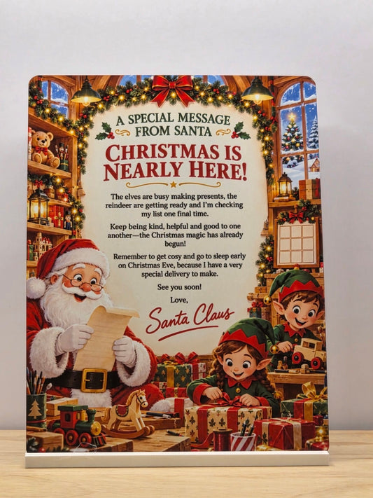 Second photograph of Christmas Is Nearly Here Santa message metal sign with Santa and elves in a festive workshop