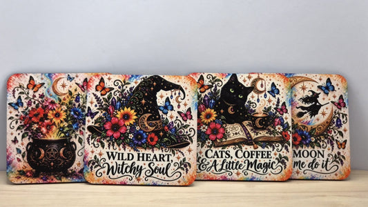 Pack of four colourful square witchy coasters featuring a floral cauldron, witch hat, black cat with coffee and flying witch