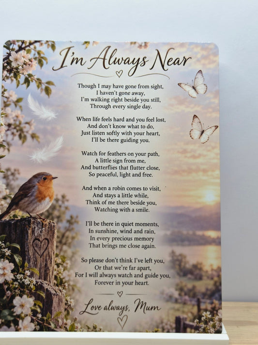 I'm Always Near Mum memorial metal sign with a robin, flowers and a remembrance poem over a soft landscape, displayed in a white stand