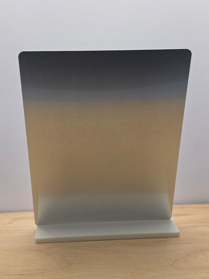 Rear view of a portrait metal sign displayed in its white freestanding stand
