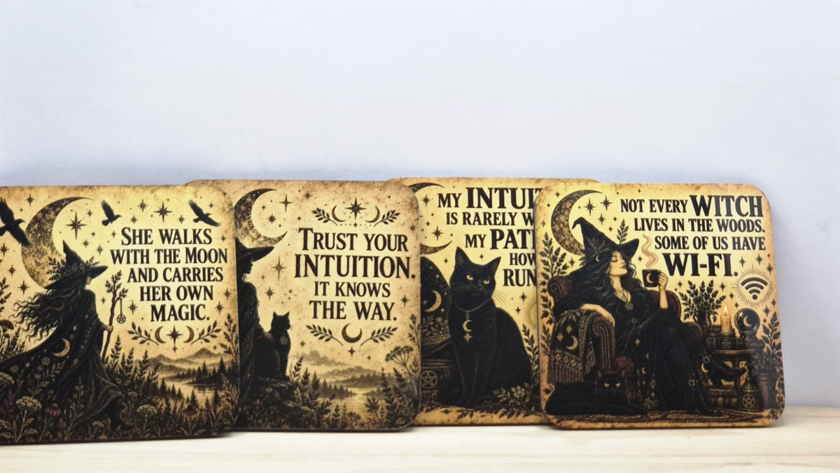 Pack of four square vintage witch quote coasters with warm golden backgrounds, witches, black cats and crescent moons