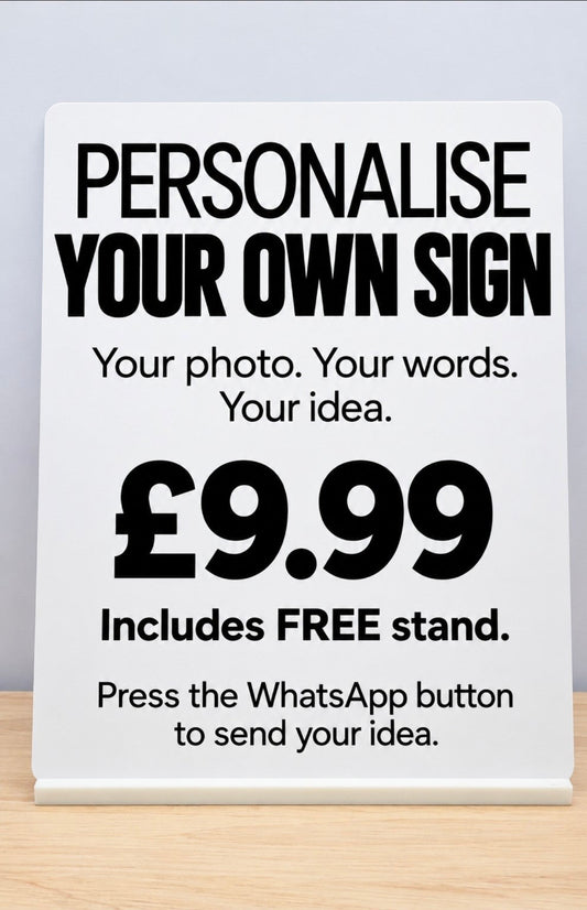Personalise Your Own Sign metal sign on white freestanding stand, £9.99 including FREE stand, on a wooden tabletop.